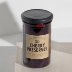 Impression sur papier adhésif kraft en couleurs foncées ou avec encre blanche.